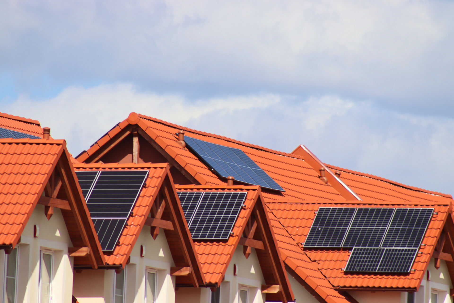 Photovoltaics, photovoltaic panels placed on the tile roof on terraced houses. Small solar panels
