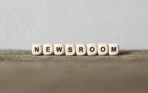 Word NEWSROOM made with wood building blocks,stock image